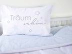 Kissen mit Träum schön auf der hellblauen Wendeseite