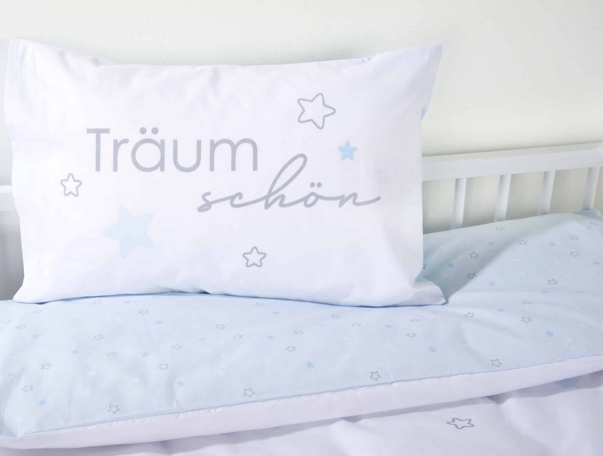 Kissen mit Träum schön auf der hellblauen Wendeseite