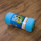 Aufgerollte Paw Patrol Fleecedecke mit Banderole